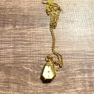 Women’s quartz pendant watch.